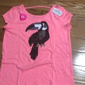 A neon pink short sleeve sequins shirt.